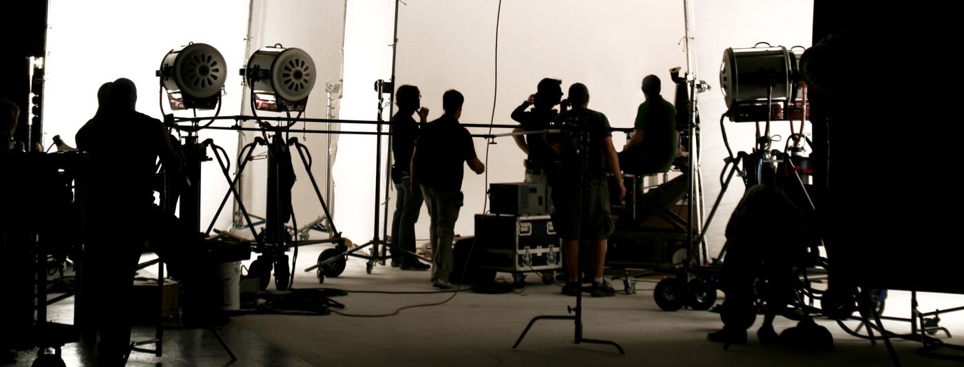 Film crew shooting on a soundstage (banner image)
