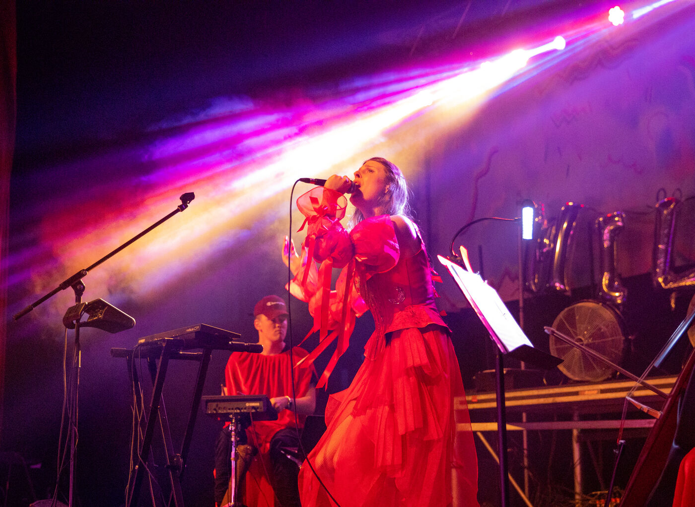 Singer and Band Performing on Stage